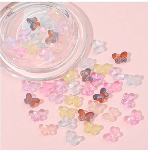 Detailed macro shot of 10x14mm colorful translucent resin butterfly beads for DIY jewelry