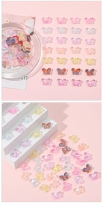 Detailed macro view of 10x14mm colorful translucent butterfly beads for DIY jewelry making