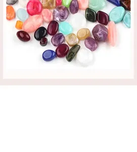 Macro shot of colorful irregular acrylic pebble beads for DIY necklace and bracelet crafts