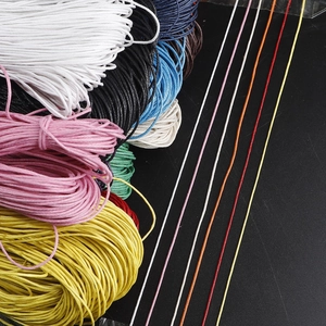 Detail view of 1mm colorful waxed cotton cords for DIY jewelry making and braiding