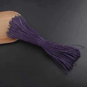 Close-up of 1mm purple waxed cotton cord for DIY jewelry and bracelet making crafts