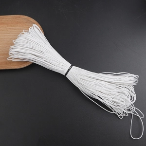 Macro detail of 1mm white waxed cotton cord bundle for DIY jewelry and beaded crafts