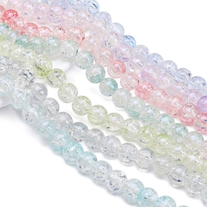 Detailed view of colorful crackle glass beads for DIY jewelry and handmade bracelets