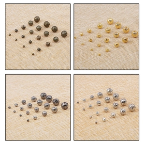 Vue détaillée de perles filigranes creuses en métal en quatre couleurs pour bijoux DIY