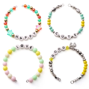 Detailed view of DIY ceramic letter beads and charm bracelet materials in 2x2 grid