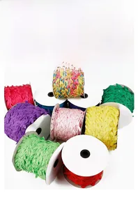 Macro detail of colorful polyester leaf trim ribbons on spools for DIY sewing and crafts