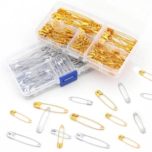 Safety pins set in gold and silver finish with multi-compartment clear storage box