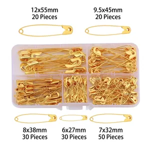 Set of gold metal safety pins in five sizes with a clear five-compartment storage box