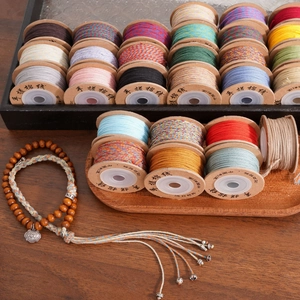 Macro shot of colorful cotton thread rolls for DIY bracelet weaving and handmade crafts