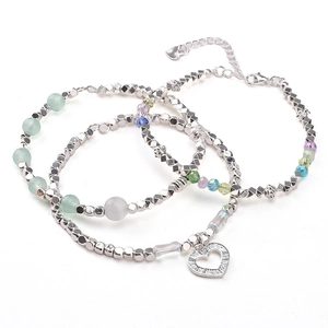 Three-piece set of silver beaded bracelets with colorful gemstones and heart pendant