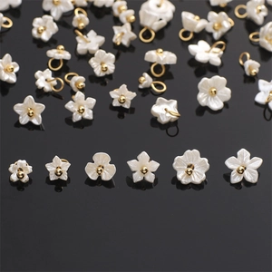 Pearlescent resin flower and star charms with gold bead accents for DIY jewelry making
