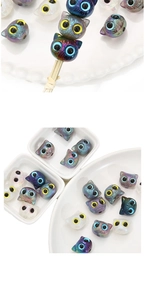 Macro view of multi-color iridized acrylic cat head beads for DIY jewelry crafts