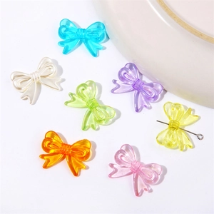 Macro shot of colorful acrylic twist bow beads for DIY jewelry making and crafts