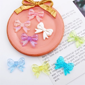 Colorful acrylic bow beads in translucent and white resin for DIY jewelry making