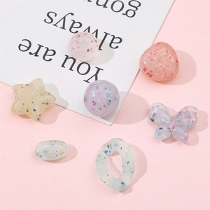 Mix of colorful acrylic star and round beads with glitter for DIY jewelry making