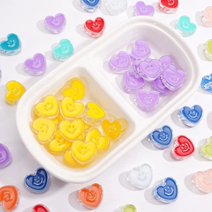 Macro shot of colorful acrylic heart smiley face beads for DIY jewelry and crafts