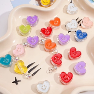 Colorful acrylic heart beads with smiley faces for DIY jewelry and phone chain making