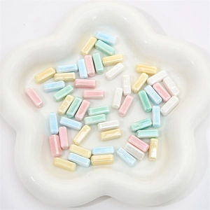 Detailed view of colorful 6x15mm rectangular ceramic beads for DIY jewelry making