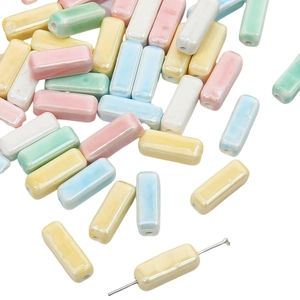 Detailed macro view of 6x15mm macaron ceramic rectangle beads with center drill holes