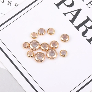Set de cuentas deslizantes de cobre dorado para joyería con topes de silicona