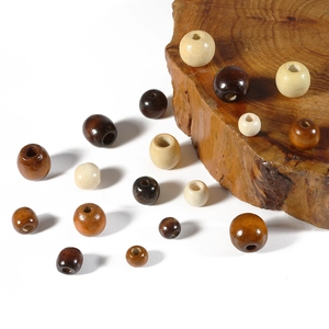 Macro detail of assorted coffee brown wooden beads with large holes for DIY crafts