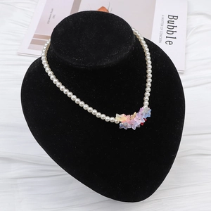 Detail of 13x12mm glass gradient beads with colorful petal charms on pearl necklace