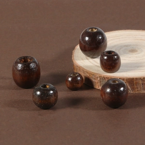 Detailed macro view of dark coffee wooden beads with polished finish on a rustic wood slice