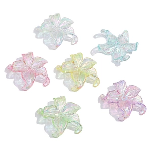 Close-up of six colorful AB coated acrylic flower beads in pastel macaron shades