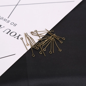 Detail of antique bronze eye pins for DIY jewelry making and handmade accessories