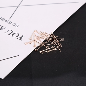 Close-up of rose gold eye pins for DIY jewelry making and earring components