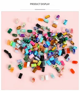 Flat lay of colorful geometric agate beads with double-hole design for DIY jewelry making