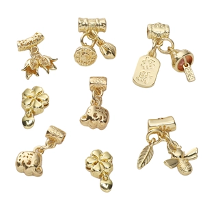 Detail of 14K gold plated lucky charms like lucky bag and flower for DIY jewelry making