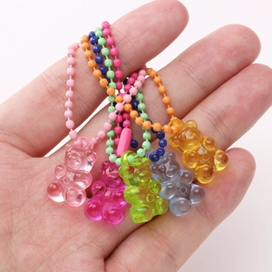 Five colorful acrylic gummy bear pendants with matching metal bead chains for DIY