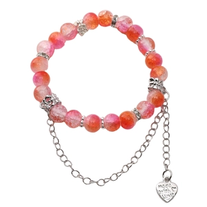 Detail of pink cracked glass beads and silver heart charm engraved with Made with Love
