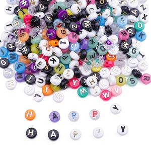 Close-up of colorful acrylic letter beads spelling HAPPY for DIY jewelry making