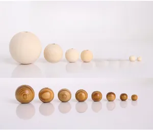 Macro shot of natural pine wood beads in various sizes showing smooth texture and wood grain