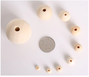 Size comparison of natural pine wood beads for DIY jewelry making with a coin reference