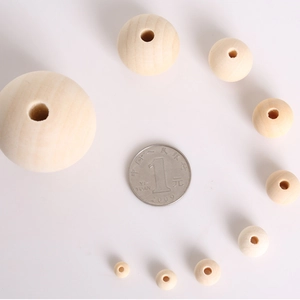 Natural round pine wood beads in various sizes with center hole for DIY jewelry making