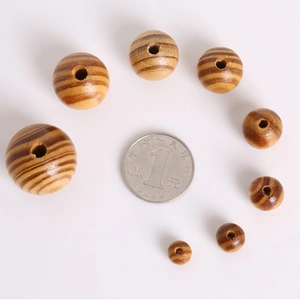 Natural round pine wood beads in various sizes with wood grain for DIY jewelry making