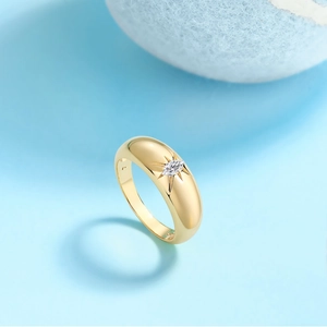 Modern gold plated S925 silver ring with marquise-cut moissanite in starburst setting
