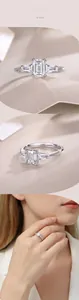 Detailed view of emerald cut moissanite ring in silver with model showcase