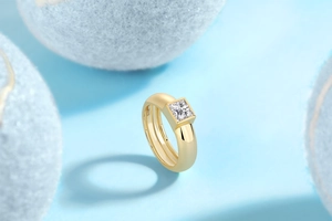Macro shot of 18K gold plated S925 silver ring featuring a square cut moissanite stone