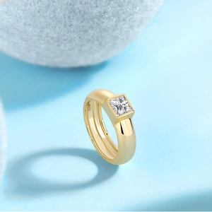 S925 gold-plated sterling silver ring with princess cut moissanite on blue background