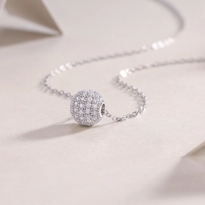 Elegant S925 sterling silver necklace featuring a sparkling round moissanite ball pendant
