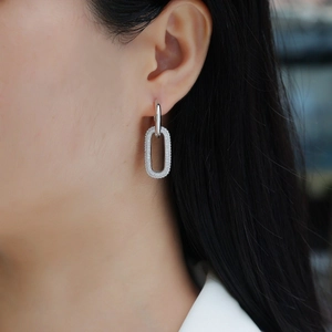 Elegant S925 silver dangle earrings with micro-set moissanite on a minimalist oval drop