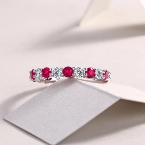 Close-up of S925 sterling silver eternity ring with red and white gemstones