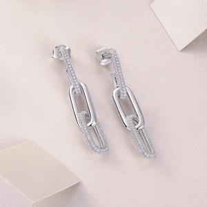Detail view of 925 silver link drop earrings with sparkling cubic zirconia pavé setting