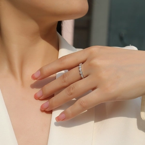 Elegant S925 sterling silver ring with sparkling moissanite stones on female finger