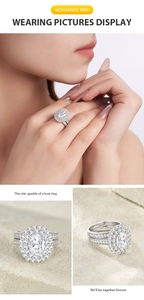 Detailed macro view of S925 sterling silver oval moissanite double ring set on model