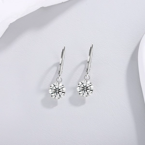 Macro detail of S925 sterling silver leverback earrings with round moissanite stones